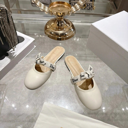CD 26 Bow Flat Mules Embroidered Sheepskin